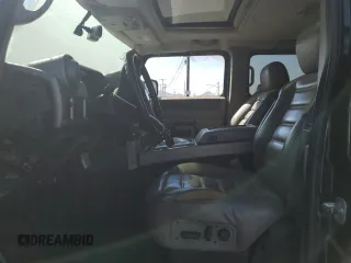 2004 Hummer H2 with VIN 5GRGN23U24H104327, listed as a Copart auction lot 74150914 with 181,933 mi miles and Salvage Title. Bid and sale history available at carsss.com. Image 7.