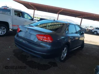 2015 Volkswagen Passat Wolfsburg Edition with VIN 1VWAT7A39FC072347, listed as a IAAI auction lot 42610199 with 116,957 mi miles and . Bid and sale history available at DreamBid. Image 4.