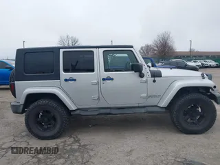 2008 Jeep Wrangler Unlimited Sahara с VIN 1J4GA59138L505460, выставлен на аукционе IAAI как лот 41846611 с пробегом 116 658 миль миль и . История ставок и продаж доступна на DreamBid. Изображение 13.