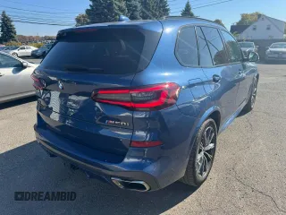 2021 BMW X5 M50i with VIN 5UXJU4C00M9H36466, listed as a Copart auction lot 77444344 with 100,119 mi miles and Clean Title. Bid and sale history available at carsss.com. Image 3.