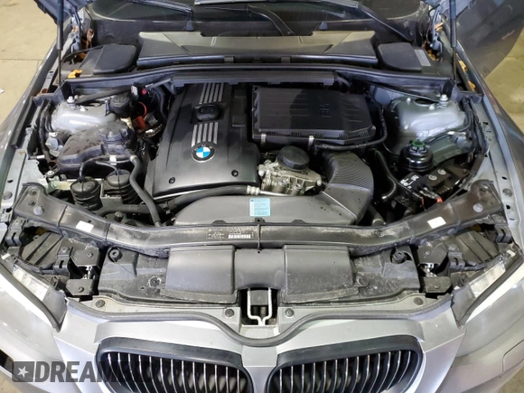 2011 BMW 3 Series 335is with VIN WBAKG1C56BE599457, listed as a Copart auction lot 52412655 with 134,497 mi miles and Clean title. Bid and sale history available at DreamBid. Image 11.