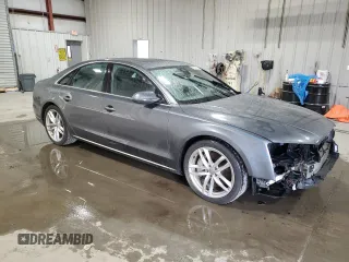 2015 Audi A8 z VIN WAUJGAFDXFN008499, wystawiony jako Copart lot #87658385 z przebiegiem 103 175 mil mil oraz Szkoda całkowita • Salvage title. Historia ofert i sprzedaży dostępna na DreamBid. Obrazek 4.