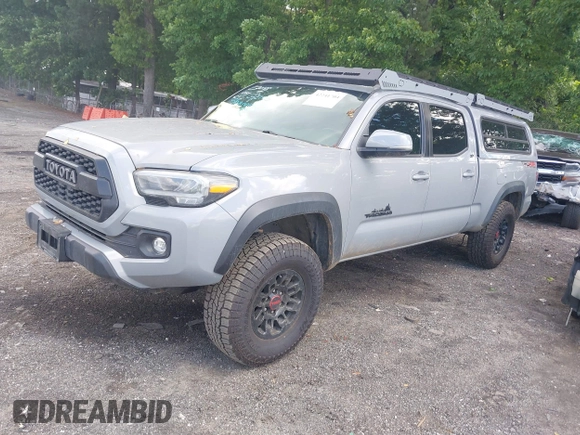 2021 Toyota Tacoma SR5 with VIN 3TMDZ5BN3MM112338, listed as a IAAI auction lot 42241704 with 81,346 mi miles and . Bid and sale history available at DreamBid. Image 2.