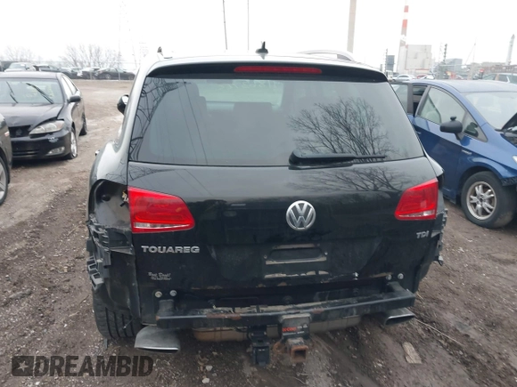 2012 Volkswagen Touareg Sport with VIN WVGFK9BP7CD002243, listed as a IAAI auction lot 41863765 with 136,231 mi miles and . Bid and sale history available at DreamBid. Image 6.