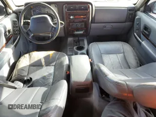 1998 Jeep Cherokee Sport with VIN 1J4FT68S7WL174028, listed as a Copart auction lot 73812524 with 0 mi miles and Salvage Title. Bid and sale history available at carsss.com. Image 8.