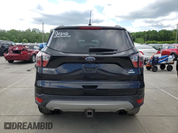 2017 Ford Escape SE z VIN 1FMCU0G93HUF10560, wystawiony jako Copart lot #57973915 z przebiegiem 127 444 mil mil oraz Czysty tytuł • Clean title. Historia ofert i sprzedaży dostępna na DreamBid. Obrazek 6.