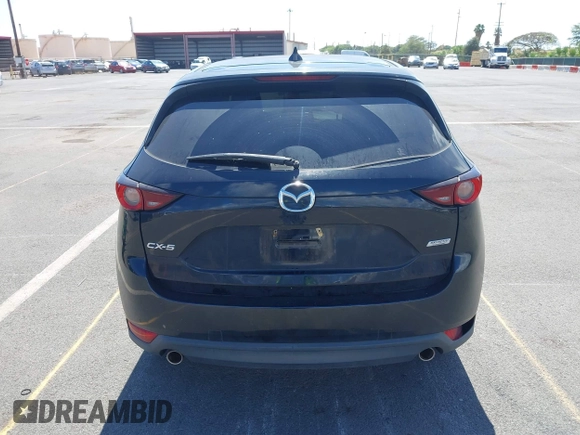 2018 Mazda CX-5 Touring z VIN JM3KFACM5J0309533, wystawiony jako IAAI lot #42195429 z przebiegiem 91 928 mil mil oraz . Historia ofert i sprzedaży dostępna na DreamBid. Obrazek 16.