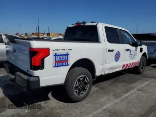 2023 Ford F-150 Lightning Pro с VIN 1FTVW1EL2PWG13712, выставлен на аукционе Copart как лот 56950955 с пробегом 60 605 миль миль и Списание • Salvage title. История ставок и продаж доступна на DreamBid. Изображение 3.
