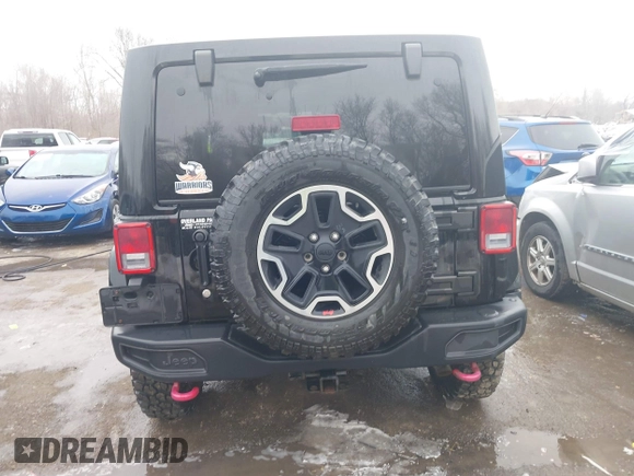 2015 Jeep Wrangler Unlimited Rubicon Hard Rock with VIN 1C4HJWFG9FL569962, listed as a IAAI auction lot 41557801 with 78,597 mi miles and . Bid and sale history available at DreamBid. Image 16.