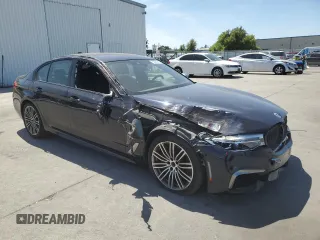2019 BMW 5 Series M550i xDrive with VIN WBAJB9C5XKB287877, listed as a Copart auction lot 52994065 with 52,460 mi miles and Salvage title. Bid and sale history available at DreamBid. Image 4.