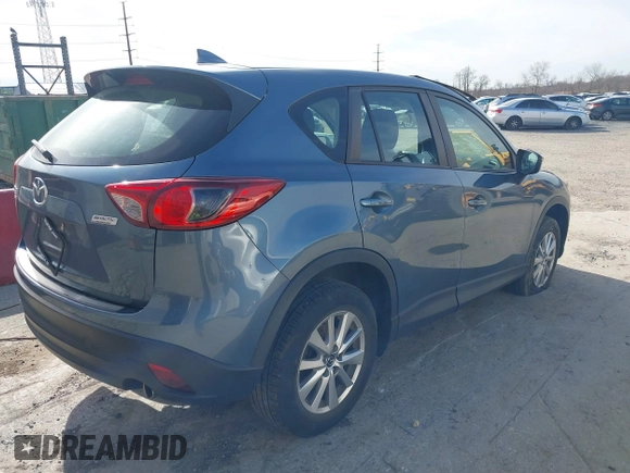 2016 Mazda CX-5 Sport with VIN JM3KE4BY0G0746034, listed as a IAAI auction lot 41842894 with 92,801 mi miles. Bid and sale history available at carsss.com. Image 4.