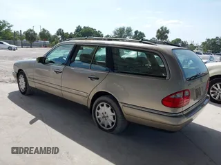 1999 Mercedes-Benz E-Class with VIN WDBJH65F3XA845635, listed as a IAAI auction lot 42102122 with 215,678 mi miles. Bid and sale history available at carsss.com. Image 3.