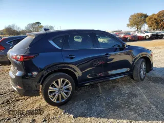2023 Mazda CX-5 Signature with VIN JM3KFBXY1P0122544, listed as a Copart auction lot 83712034 with 27,032 mi miles and Salvage Title. Bid and sale history available at DreamBid. Image 3.