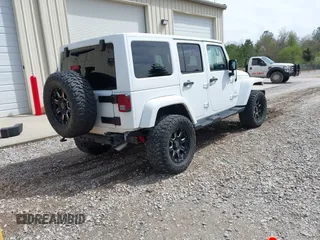 2017 Jeep Wrangler Unlimited Sahara with VIN 1C4BJWEG8HL734572, listed as a IAAI auction lot 41863636 with 123,979 mi miles. Bid and sale history available at carsss.com. Image 4.