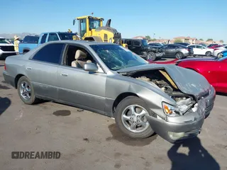1997 Lexus ES 300 z VIN JT8BF22G1V0037870, wystawiony jako IAAI lot #42572906 z przebiegiem 218 006 mil mil oraz . Historia ofert i sprzedaży dostępna na DreamBid. Obrazek 1.