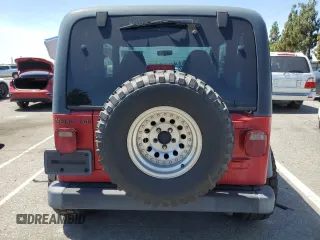 1999 Jeep Wrangler Sport with VIN 1J4FY19S7XP401120, listed as a Copart auction lot 64233665 with 129,708 mi miles and Salvage title. Bid and sale history available at DreamBid. Image 6.