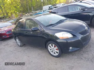 2009 Toyota Yaris with VIN JTDBT903894044347, listed as a IAAI auction lot 42069061 with 197,348 mi miles. Bid and sale history available at carsss.com. Image 1.