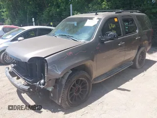 2013 GMC Yukon SLT with VIN 1GKS2CE04DR290293, listed as a IAAI auction lot 39620358 with 167,664 mi miles. Bid and sale history available at carsss.com. Image 2.