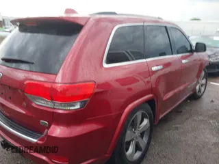 2014 Jeep Grand Cherokee Overland with VIN 1C4RJFCG9EC460165, listed as a IAAI auction lot 42092137 with 131,802 mi miles and . Bid and sale history available at DreamBid. Image 14.