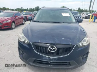 2014 Mazda CX-5 Grand Touring with VIN JM3KE2DY8E0425258, listed as a IAAI auction lot 42179452 with 132,137 mi miles. Bid and sale history available at carsss.com. Image 6.