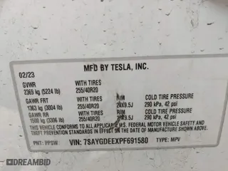 2023 Tesla Model Y Long Range with VIN 7SAYGDEEXPF691580, listed as a IAAI auction lot 41728604 with 19,601 mi miles. Bid and sale history available at carsss.com. Image 9.