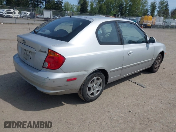 2005 Hyundai Accent GLS with VIN KMHCG35C65U332999, listed as a IAAI auction lot 42097932 with 225,593 mi miles. Bid and sale history available at carsss.com. Image 4.