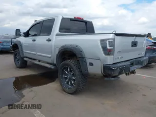 2014 Nissan Titan Pro-4X with VIN 1N6BA0EC7EN513116, listed as a IAAI auction lot 42193466 with 147,240 mi miles and . Bid and sale history available at DreamBid. Image 3.