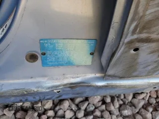 2006 Suzuki Aerio Premium z VIN JS2RA62S665301623, wystawiony jako Copart lot #77708054 z przebiegiem 189 464 mil mil oraz Szkoda całkowita • Salvage title. Historia ofert i sprzedaży dostępna na DreamBid. Obrazek 14.