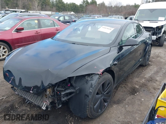 2021 Tesla Model S Plaid with VIN 5YJSA1E69MF439147, listed as a IAAI auction lot 41825656 with 25,626 mi miles. Bid and sale history available at carsss.com. Image 2.
