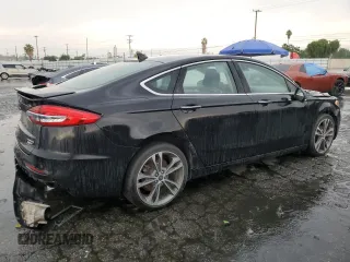 2020 Ford Fusion Titanium with VIN 3FA6P0D94LR153375, listed as a Copart auction lot 59609415 with 104,292 mi miles and Clean title. Bid and sale history available at DreamBid. Image 3.