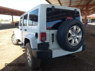 2016 Jeep Wrangler Unlimited Sahara with VIN 1C4BJWEG0GL126270, listed as a IAAI auction lot 42229364 with 50,847 mi miles and . Bid and sale history available at DreamBid. Image 3.
