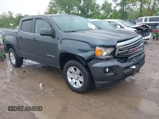 2015 GMC Canyon 2WD SLE with VIN 1GTG5BE39F1134104, listed as a IAAI auction lot 42390689 with 73,785 mi miles and . Bid and sale history available at DreamBid. Image 1.