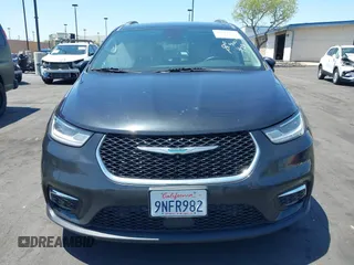 2021 Chrysler Pacifica Hybrid Touring L with VIN 2C4RC1L71MR599631, listed as a IAAI auction lot 42151965 with 67,401 mi miles and . Bid and sale history available at DreamBid. Image 12.