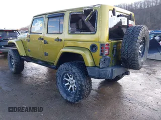 2007 Jeep Wrangler Unlimited Sahara with VIN 1J4GA59187L189519, listed as a IAAI auction lot 41204036 with 165,428 mi miles and . Bid and sale history available at DreamBid. Image 3.