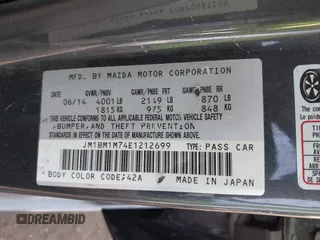 2014 Mazda 3 i Grand Touring with VIN JM1BM1M74E1212699, listed as a IAAI auction lot 41804428 with 195,472 mi miles and . Bid and sale history available at DreamBid. Image 9.