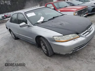2002 Honda Accord SE z VIN 1HGCG56742A067127, wystawiony jako IAAI lot #41780877 z przebiegiem 230 226 mil mil oraz . Historia ofert i sprzedaży dostępna na DreamBid. Obrazek 1.