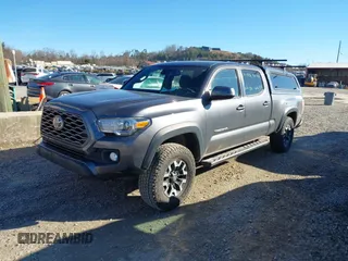 2021 Toyota Tacoma 4WD SR5 with VIN 5TFDZ5BN8MX058531, listed as a IAAI auction lot 41628820 with 102,004 mi miles. Bid and sale history available at carsss.com. Image 2.