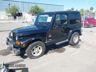 2001 Jeep Wrangler Sahara z VIN 1J4FA59S41P313113, wystawiony jako IAAI lot #42266173 z przebiegiem 125 792 mil mil oraz . Historia ofert i sprzedaży dostępna na DreamBid. Obrazek 17.