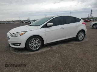 2018 Ford Focus Titanium z VIN 1FADP3N21JL230757, wystawiony jako Copart lot #65086685 z przebiegiem 52 296 mil mil oraz Szkoda całkowita • Salvage title. Historia ofert i sprzedaży dostępna na DreamBid. Obrazek 1.
