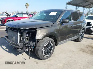 2023 Kia Telluride S with VIN 5XYP6DGC3PG359562, listed as a IAAI auction lot 42675786 with 46,681 mi miles and . Bid and sale history available at DreamBid. Image 2.