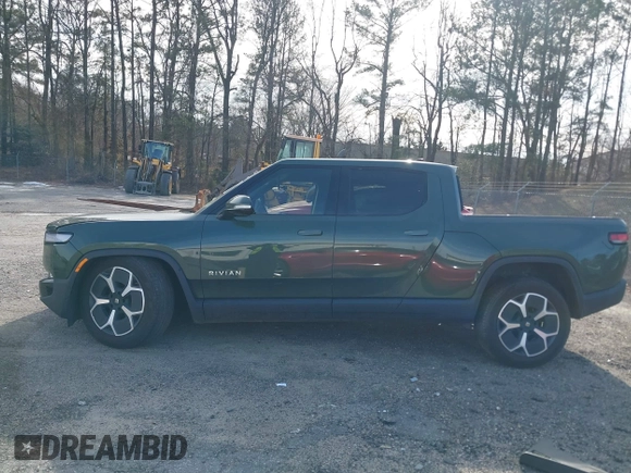 2022 Rivian R1T Adventure z VIN 7FCTGAAA8NN015369, wystawiony jako IAAI lot #41407842 z przebiegiem 22 507 mil mil oraz . Historia ofert i sprzedaży dostępna na DreamBid. Obrazek 14.