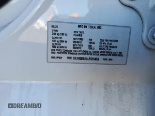 2020 Tesla Model Y Long Range with VIN 5YJYGDEE4LF015455, listed as a Copart auction lot 84223984 with 77,398 mi miles and Salvage Title. Bid and sale history available at DreamBid. Image 14.