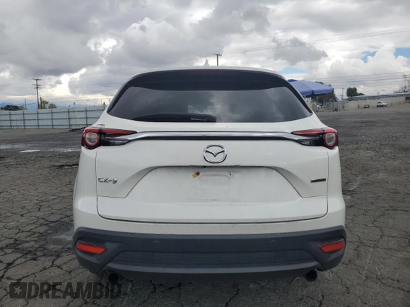 2021 Mazda CX-9 Touring with VIN JM3TCACY5M0527069, listed as a Copart auction lot 43014655 with 66,989 mi miles and Salvage title. Bid and sale history available at DreamBid. Image 6.