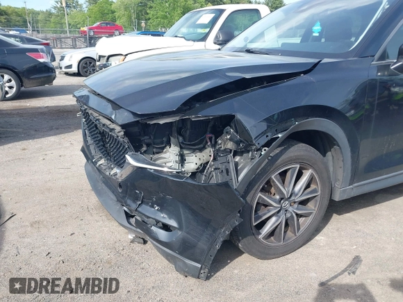 2018 Mazda CX-5 Touring z VIN JM3KFBCM9J0358997, wystawiony jako IAAI lot #42332606 z przebiegiem 93 952 mil mil oraz . Historia ofert i sprzedaży dostępna na DreamBid. Obrazek 6.