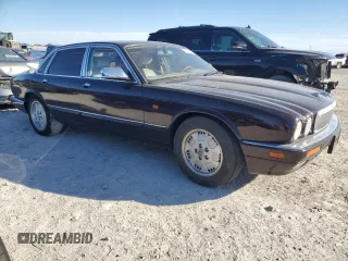 1995 Jaguar XJ with VIN SAJKX1743SC734007, listed as a Copart auction lot 46340825 with 130,115 mi miles and Salvage Title. Bid and sale history available at DreamBid. Image 4.