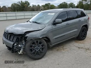 2020 Jeep Grand Cherokee Laredo E with VIN 1C4RJEAG0LC404979, listed as a Copart auction lot 81999474 with 57,328 mi miles and Salvage title. Bid and sale history available at DreamBid. Image 1.