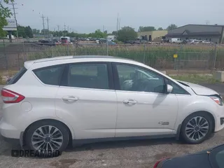 2017 Ford C-Max Titanium z VIN 1FADP5FU1HL100046, wystawiony jako IAAI lot #42356813 z przebiegiem 57 737 mil mil oraz . Historia ofert i sprzedaży dostępna na DreamBid. Obrazek 13.