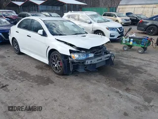 2014 Mitsubishi Lancer Evolution MR with VIN JA32W5FV5EU017592, listed as a IAAI auction lot 41158408 with 97,614 mi miles. Bid and sale history available at carsss.com. Image 1.