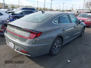 2022 Hyundai Sonata Hybrid Blue with VIN KMHL24JJ5NA037502, listed as a IAAI auction lot 40975379 with 69,018 mi miles. Bid and sale history available at carsss.com. Image 4.