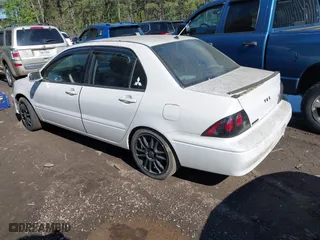 2003 Mitsubishi Lancer LS with VIN JA3AJ36E73U054672, listed as a IAAI auction lot 42002271 with 263,568 mi miles. Bid and sale history available at carsss.com. Image 3.